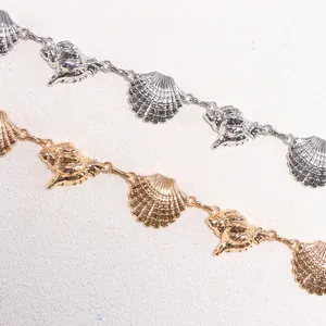 Bohemian style seashell waist chain with gold and silver starfish and conch metal charms