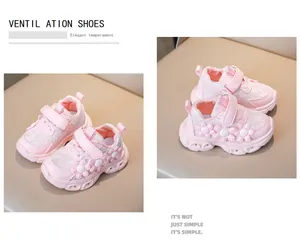 Detailed view of breathable lace mesh upper with 3D daisy flower accents on pink girls shoes