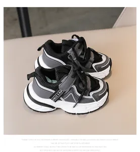 Close-up of kids mesh sneakers with non-slip thick white soles and velcro straps