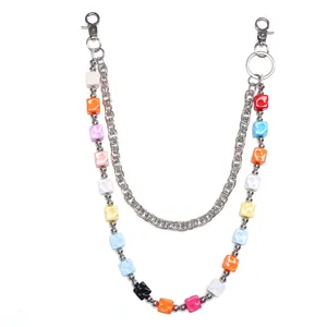 Close-up of double-layer chain with colorful cheese cube beads and lobster clasp detail