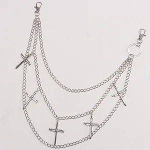 Detail view of multi-layer silver pants chain with gothic cross pendants and lobster clasps