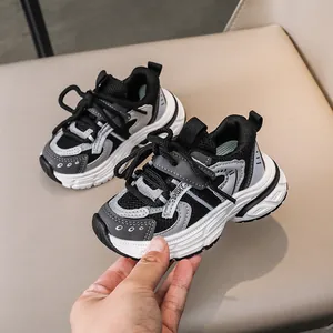 Detail showing kids sneakers with breathable mesh, hook-and-loop closure, and thick sole