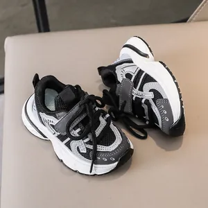 Detail of kids sneakers showing Velcro strap and breathable mesh stitching