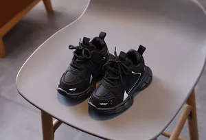 Top view of black children's chunky sneakers with mesh fabric and anti-slip thick soles