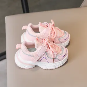 Detail of pink toddler sports shoes showing breathable mesh and durable velcro strap