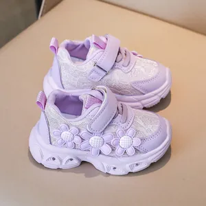 Close-up of girls' purple floral sneakers with mesh texture and lace floral applique detail