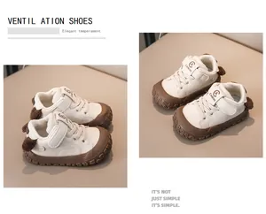 Detail of baby sneakers with brown rubber soles and cute plush ear decorations