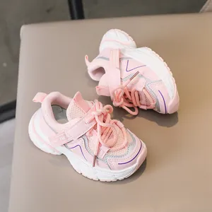 Detailed top view of pink kids sports shoes featuring mesh panels and velcro straps