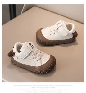 Detail view of baby toddler sneakers featuring anti-collision rubber toes and plush heel balls