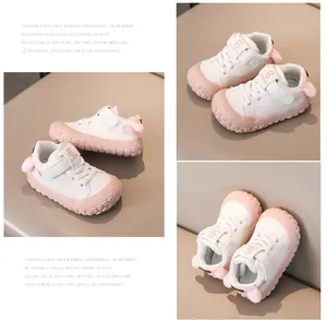 Close-up of pink bunny ear heel detail and anti-slip rubber sole on baby walking shoes