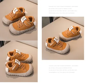 Detail of yellow toddler sneaker featuring Velcro closure and grey anti-collision rubber toe