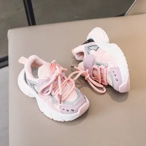 Detail view of pink and purple children's sneakers with breathable mesh and thick soles