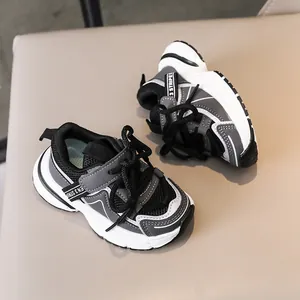 Detail of children sneakers with breathable mesh upper and non-slip wavy rubber sole