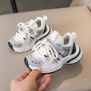 Detail view of breathable mesh and synthetic leather layers on kids chunky sneakers