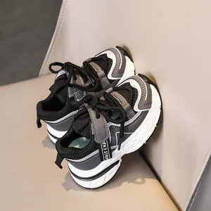 Detail of kids breathable mesh sports sneakers with chunky anti-slip rubber soles