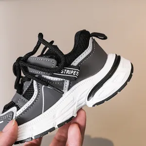 Detail of kids breathable mesh sneaker with STRIPES tape and thick non-slip rubber sole