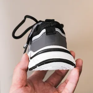 Detailed view of the anti-slip rubber sole and breathable mesh on children's sneakers