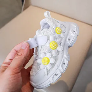 Detail of girls floral sneaker with lace mesh upper and Velcro strap closure