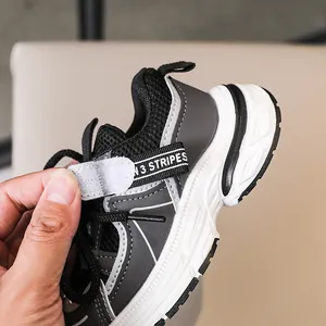 Detail shot of the adjustable hook and loop fastener on the breathable mesh sneaker