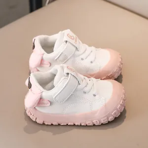 Detailed view of pink toddler shoes with reinforced toe cap and velcro closure