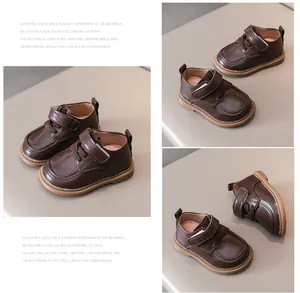 Detail view of dark brown vintage baby shoes with non-slip soles and velcro straps