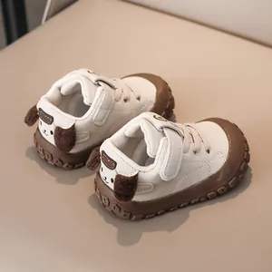Detail showing non-slip rubber sole and cute 3D plush puppy dog ears on baby walking shoes