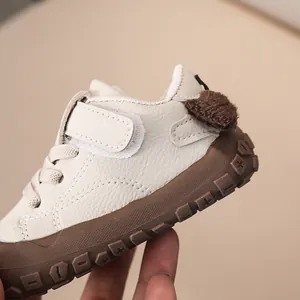 Macro detail of toddler sneaker with anti-slip rubber sole and leather texture details