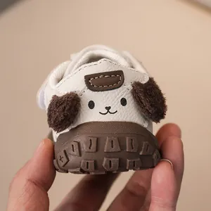 Close-up of baby walking shoes with cartoon puppy ears and non-slip rubber soles