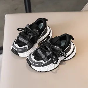 Kids breathable mesh running shoes in black and grey with chunky soft soles for boys and girls