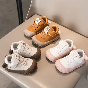 Modern toddler sneakers in three colors displayed on a chair for infants' spring wear