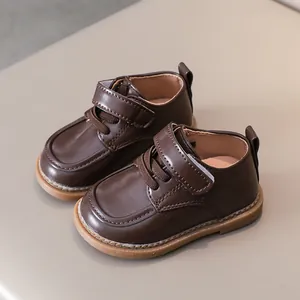 Dark brown baby leather walking shoes with non-slip rubber soles and velcro straps
