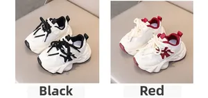 Detail view of breathable mesh kids sneakers in black and red with anti-slip thick soles