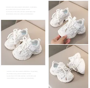 Macro detail of white kids sneakers featuring breathable mesh and cute bow embellishments