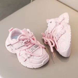 Detail of pink girls' sneaker featuring breathable mesh, thick sole and bow ornament