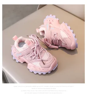 Detail of pink and purple kids chunky sneakers with mesh upper and double velcro straps