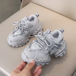 Detail of grey kids chunky sneakers featuring breathable mesh and thick anti-slip rubber soles