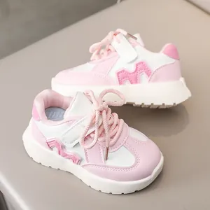 Pink and white leather kids sneakers featuring thick non-slip soles and side M-logo detail