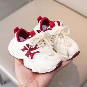 Close-up of children's thick-soled sneakers featuring breathable mesh and maroon details