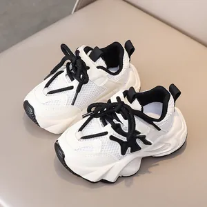 Detail of kids breathable mesh sneaker featuring thick cushioned soles and black laces