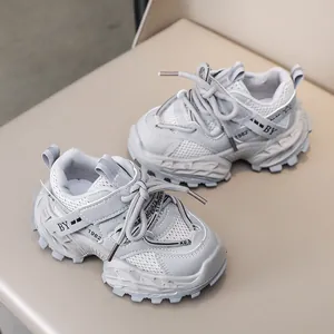 Detailed view of kids' gray chunky sneakers with breathable mesh and anti-slip sole