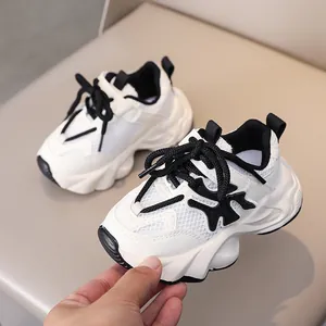 Detailed macro view of breathable mesh and faux leather stitching on kids sports shoes