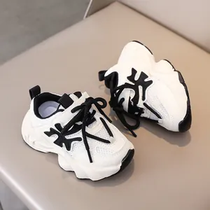 Close-up of kids breathable mesh sneakers with chunky soles and contrast leather panels