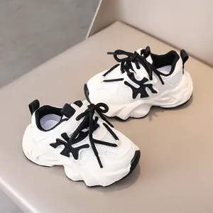Detailed macro view of kids sneakers featuring breathable mesh and thick anti-slip sole
