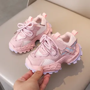 Close-up of pink breathable mesh and synthetic leather texture on kids sneakers
