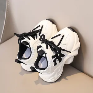 Detail view of children's breathable mesh sneakers with chunky white shock-absorbing soles