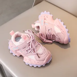 Close-up of pink breathable kids' sneakers featuring mesh fabric and durable velcro strap