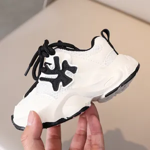 Detail of kids breathable mesh sneakers with non-slip thick sole and lace-up closure