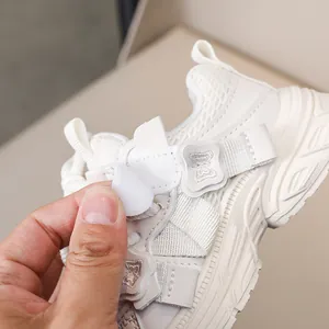 Detail of toddler mesh sneakers featuring easy hook-and-loop closure and butterfly applique