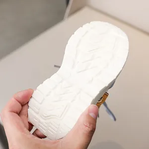 Close-up of non-slip rubber sole with size 23 detail for children's sneakers