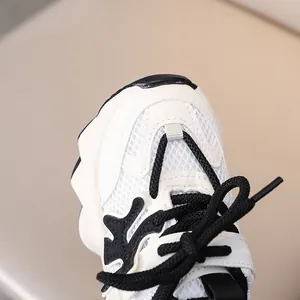 Detail of children's mesh sneaker featuring breathable fabric and non-slip thick sole